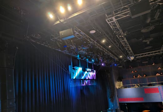 Stage and curtain under the Billboard Live logo inside the Tokyo Midtown club