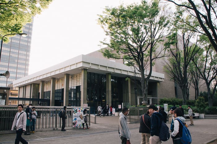 The low modernist front of NHK Hall among zelkova trees in Jinnan, Shibuya