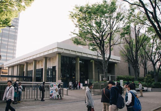 The low modernist front of NHK Hall among zelkova trees in Jinnan, Shibuya