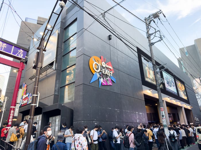 Black facade of Spotify O-EAST with its logo on Dogenzaka, Shibuya