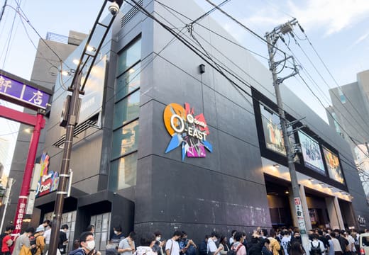 Black facade of Spotify O-EAST with its logo on Dogenzaka, Shibuya